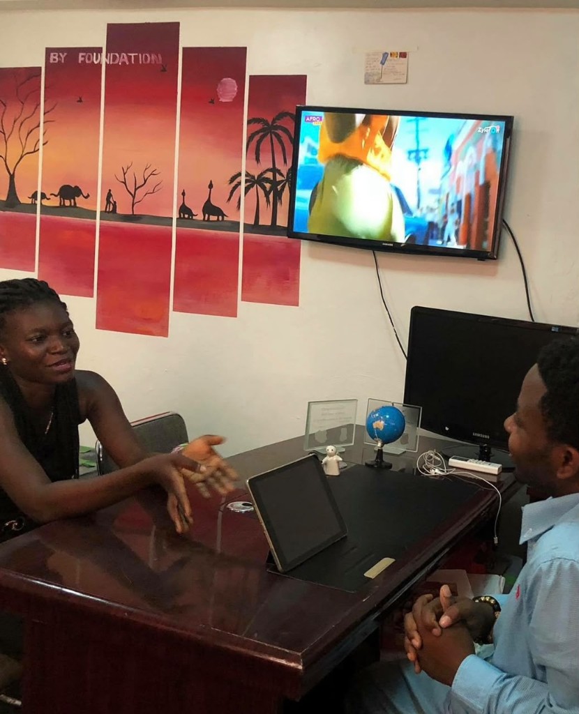 A beneficiary visiting the B.Y. Foundation office to thank the team