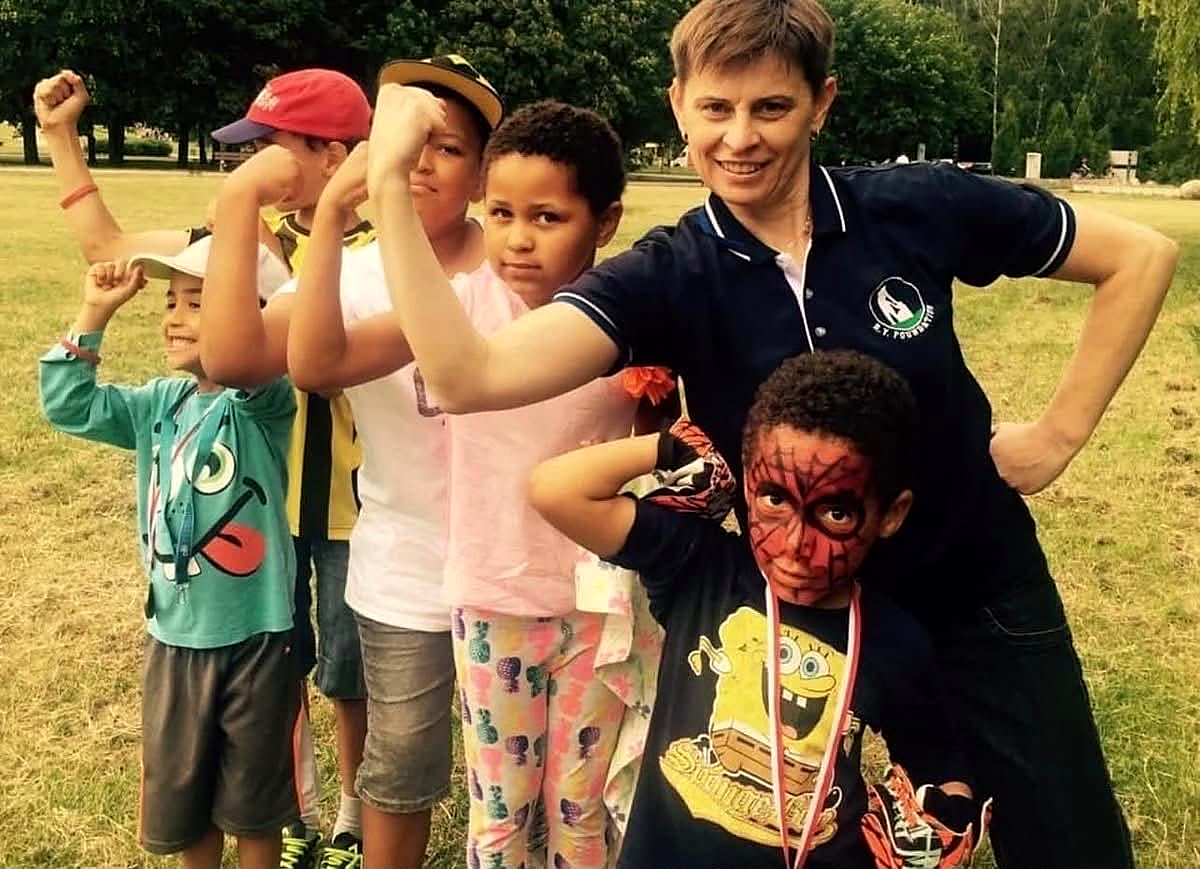 Children and a B.Y. Foundation volunteer
