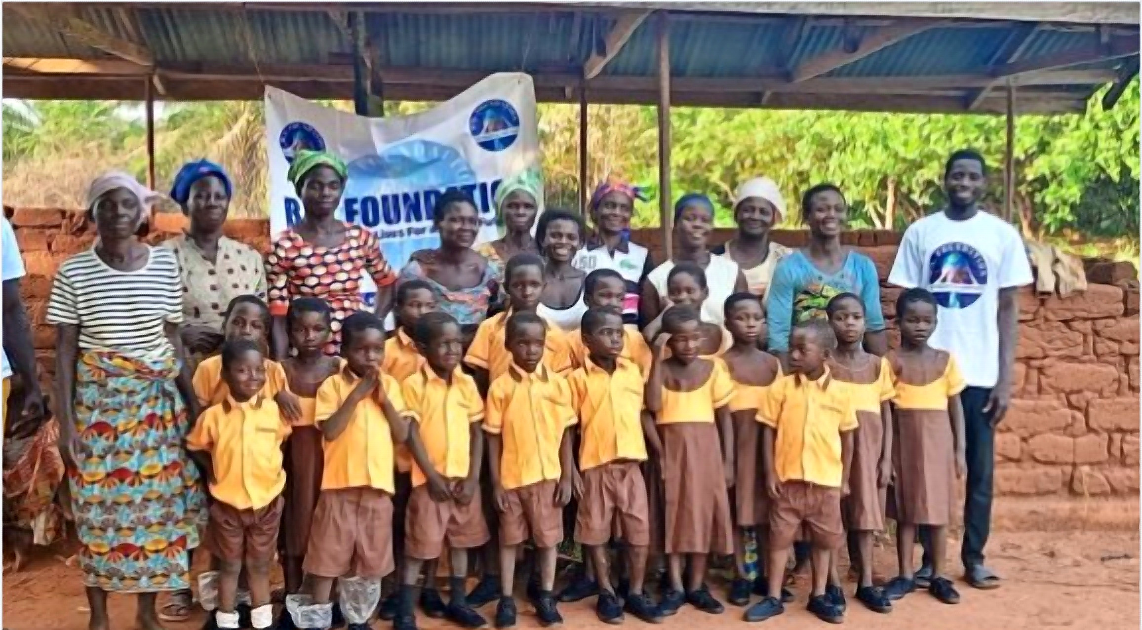 Children and adults gathered with the foundation