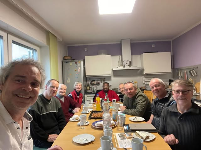 Partners gathered around a table in Germany